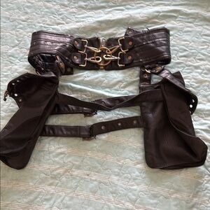 Black Belt with Gold-Toned Hardware and Decorative Elements
